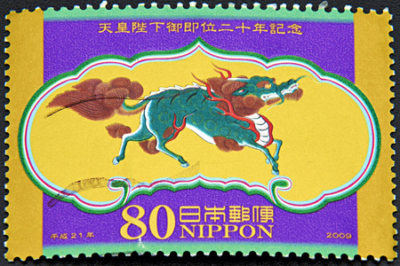 GRANADA, SPAIN - NOVEMBER 30, 2015: A stamp printed in Japan shows gragon flying against of yellow background, 2009のeditorial素材