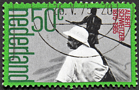 GRANADA, SPAIN - NOVEMBER 30, 2015: A stamp printed in Netherlands shows Albert Schweitzer, circa 1990のeditorial素材