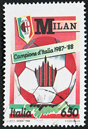 GRANADA, SPAIN - NOVEMBER 30, 2015: A stamp printed in Italy dedicated to  A. C. Milan, National Football Champion, 1987-88のeditorial素材