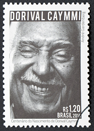GRANADA, SPAIN - NOVEMBER 30, 2015: A stamp printed in Brazil dedicated to  centenary of the birth of Dorival Caymmi, 2014のeditorial素材