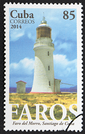 GRANADA, SPAIN - NOVEMBER 30, 2015: A stamp printed in Cuba shows Lighthouse of El Morro, Santiago de Cuba, 2014のeditorial素材