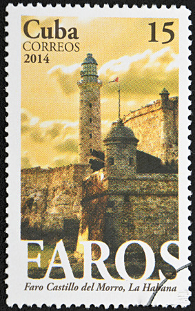 GRANADA, SPAIN - NOVEMBER 30, 2015: A stamp printed in Cuba shows old cuban fortress, Morro Castle lighthouse, La Habana, 2014のeditorial素材