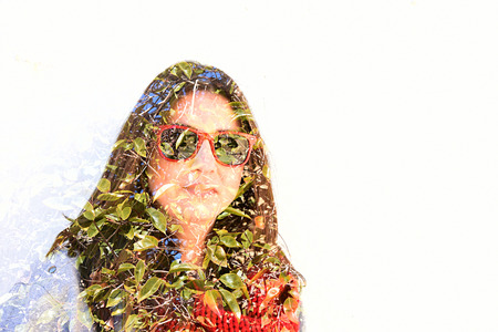 Woman with leaves. Double exposure taken with camera.の写真素材
