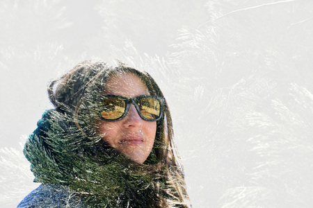 Young woman with fir. Double exposure made with the camera.