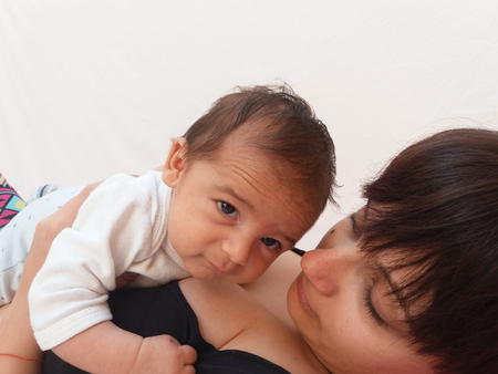 mum holding baby boyの写真素材