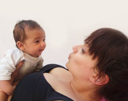 mum holding baby boyの写真素材