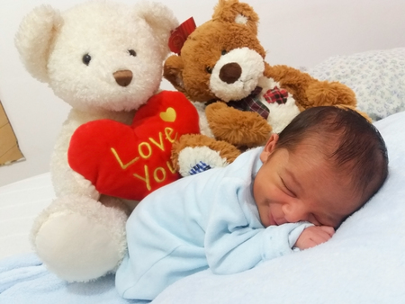 five days old sleeping baby boy calm and relaxedの写真素材