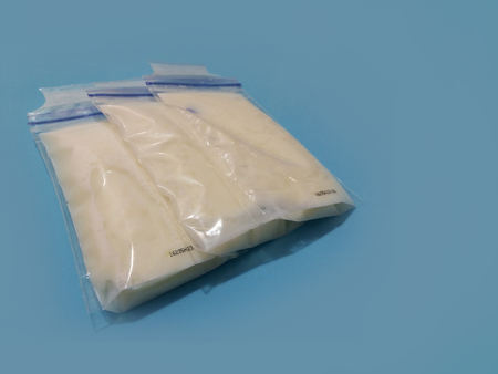 breat milk in 3 storage bags blue backgraoundの写真素材