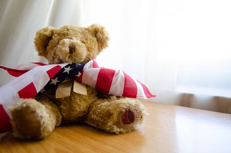 little teddy bear with USA flag - happy memorial dayの写真素材