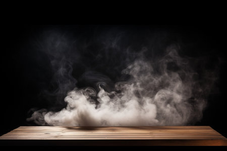empty wooden table with smoke float up on dark background. High quality photoの素材