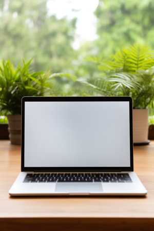Laptop Computer Blank White Screen on Table in Coffee Cafe. High quality photoの素材