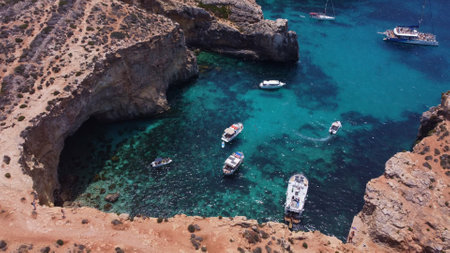 Comino, Malta 29.05.2024 - L-Ghar ta Bla Saqaf or The roofles Cave on Comino island Malta, Aerial View. Pebble cove. High quality photoのeditorial素材