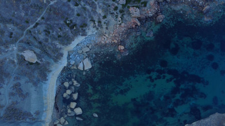 Rocky beach and sapphire sea water on the Maltese island, mediterranean sea, Ghajn Tuffieha bay , Malta. High quality photoの写真素材