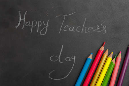 Happy Teacher day concept, slate board with pencil , spectacles , top view with copy spaceの写真素材