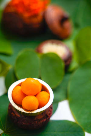 ,Indian festival dussehra , green leaf with rice and sweetsの写真素材