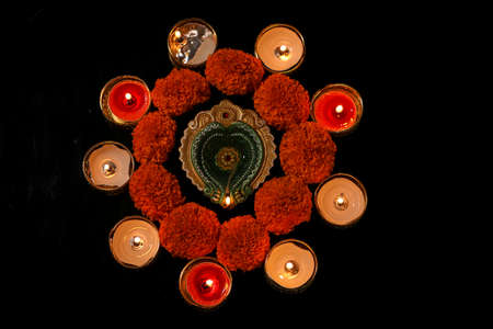 Indian Festival Diwali , oil lamp and flower design on dark backgroundの写真素材