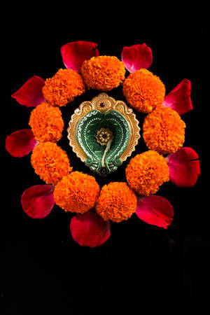 Indian Festival Diwali , oil lamp and flower design on dark backgroundの写真素材