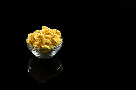 Indian snacks in bowl on dark backgroundの写真素材