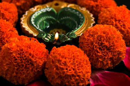 Indian Festival Diwali , oil lamp and flower design on dark backgroundの写真素材