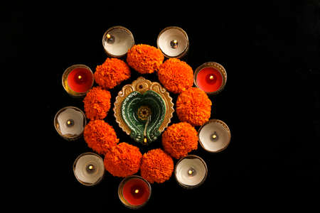 Indian Festival Diwali , oil lamp and flower design on dark backgroundの写真素材