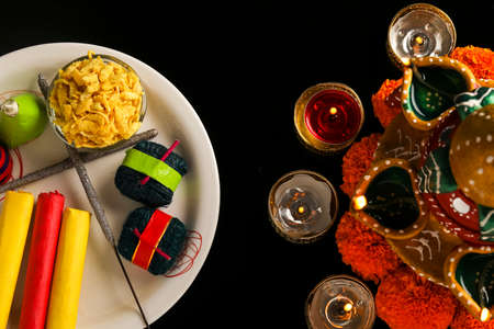 fire crackers,lamp and flower on dark background , Indian festival Diwaliの写真素材