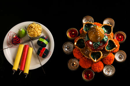 fire crackers,lamp and flower on dark background , Indian festival Diwaliの写真素材