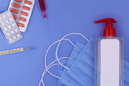 Protective medical mask, pills ,thermometer, syringe,hand sanitizer, corona virus protection,Concept...