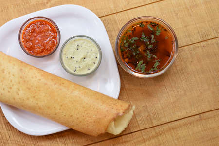 Masala dosa , South Indian meal served with sambhar and coconut chutney over,Traditional South Indian rice Dosa , Indian food,Selective focusの写真素材