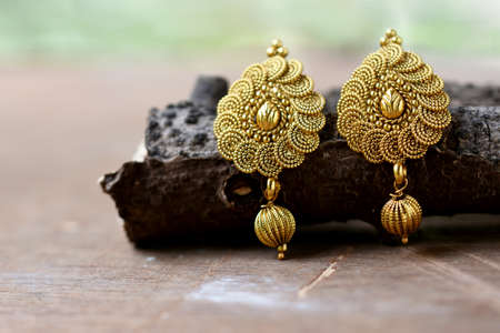 Beautiful Golden pair of earrings, Luxury female jewelry, Indian traditional jewellery,indian jewellery Bridal Gold earrings wedding jewelleryの写真素材