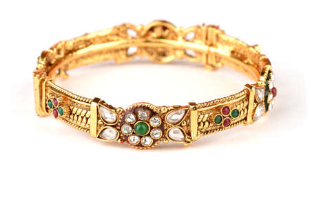 Indian golden Bangles. Bracelet with diamonds and stones on a white background, Indian Traditional...