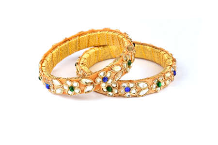 Indian golden Bangles. Bracelet with diamonds and stones on a white background, Indian Traditional...