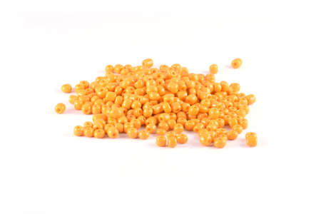 Beads spread on white background. Background or texture of beads. Close up, macro,It is used in finishing fashion clothes. make bead necklace or beads for woman of fashion,Bead Crochet. Daily Beading.の写真素材