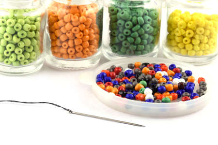 Color beads with needle.Beads in bottle.used in finishing fashion clothes. make bead necklace, beads for women of fashion,Bead Crochet. Daily Beading.の写真素材
