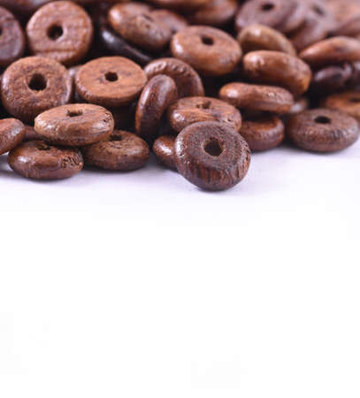 Wooden beads close-up  on white background. Close up, macro.の写真素材