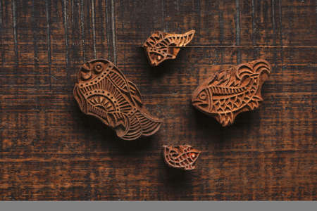 Different size of fish shape wood block pattern for textile printing on rustic wood background. Block Printing,Rajasthan India Block Printing, Wood block used for handmade textile printing,Hand craftの写真素材