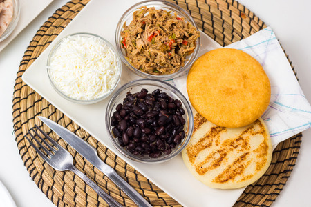 Venezuelan typical food, arepas and their different combinations. Chicken, fish, meat, cheese, black beans and pork.の写真素材