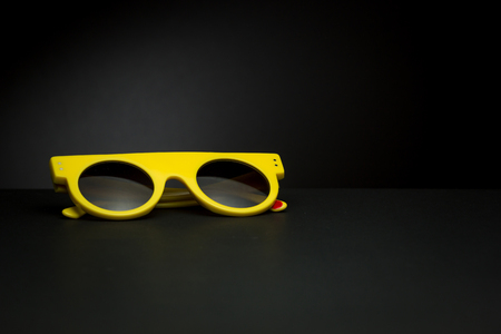 Stylish sunglasses for summer on a black backgroundの写真素材