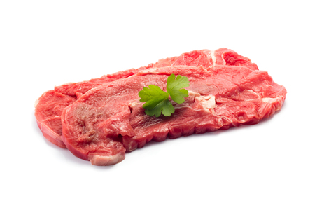 Raw beef steak on whiteの写真素材