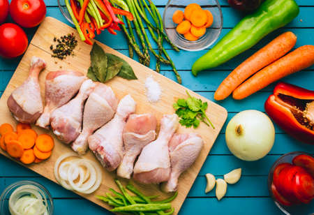 Chicken thighs and ingredients for cookingの写真素材