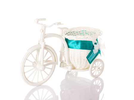toy bicycle with basket on white backgroundの写真素材