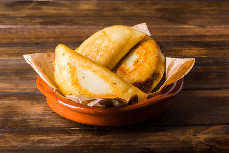 Venezuelan typical food, Empanadas on wood table ready to eatの写真素材
