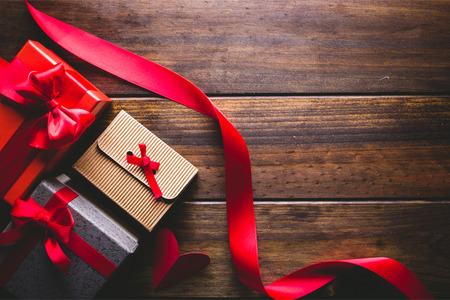 Valentine's gifts on a wooden background.の写真素材