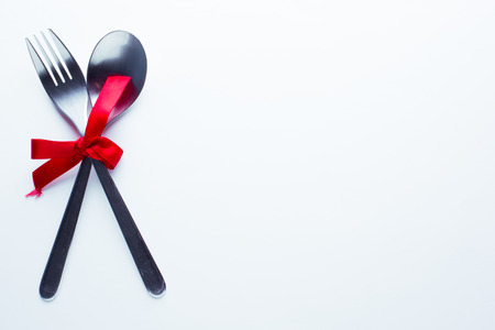 Valentine's day concept fork and spoon indicating a dinner seen from above.の写真素材