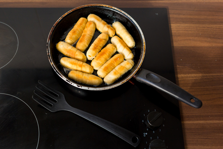 Cheese fingers in a pan with hot oil. Venezuelan typical food. Tequeñosの写真素材