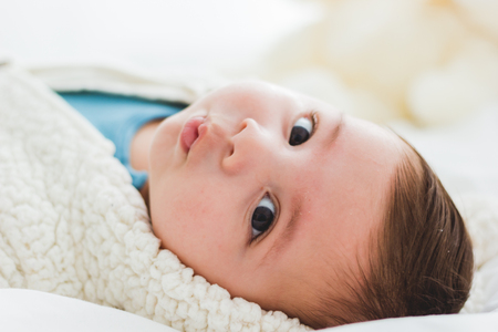 Face of adorable baby looking at cameraの写真素材