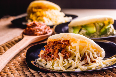 Different types of arepas, meat, black beans, cheese, typical South American foodの写真素材