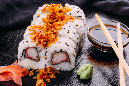 Sushi roll served with wasabi and gingerの写真素材