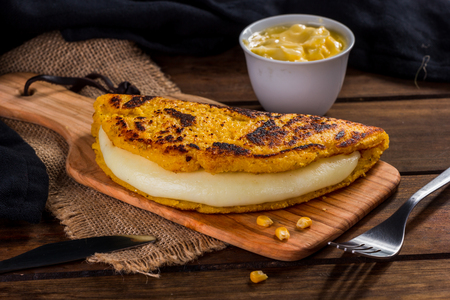Cachapa with cheese, typical Venezuelan dish made with corn, cheese and butterの写真素材