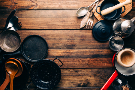 Top view of wooden rustic table with various kitchen utensilsの写真素材