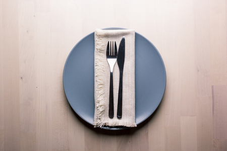 Top view of a restaurant table with plate, knife and fork, restaurant conceptの写真素材